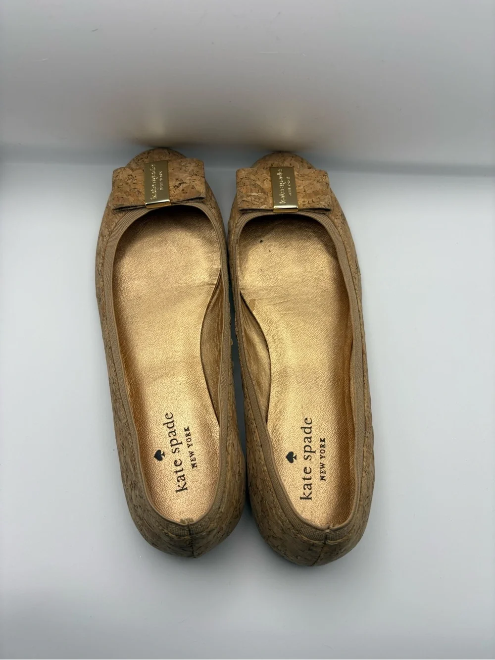 kate spade cork bow flats in tan with gold plaque